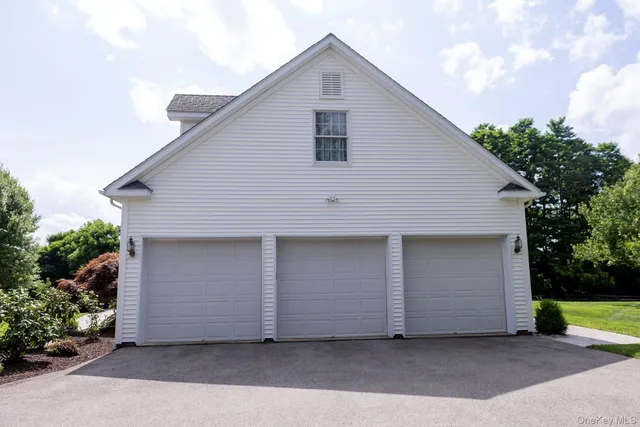 a front view of house with garage