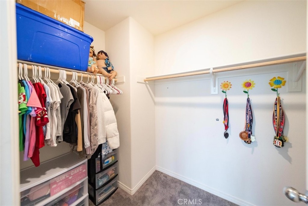 32078 Rambling Court Winchester, CA 92596 - Photo 33 of 48 a view of walk in closet with clothes
