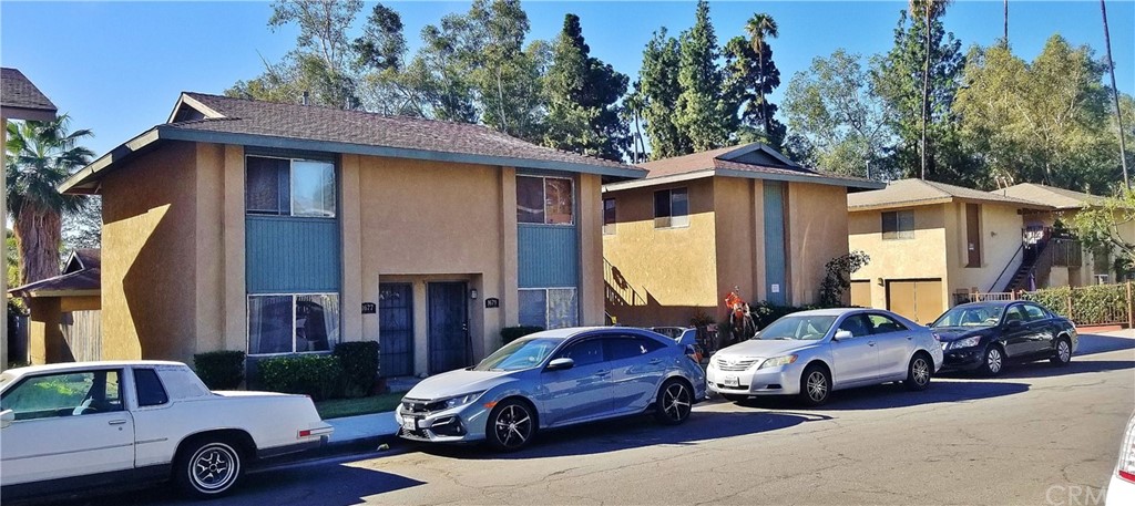 1677 West Wilson Street Rialto, CA 92376 - Photo 1 of 1 a front view of a house with parking space