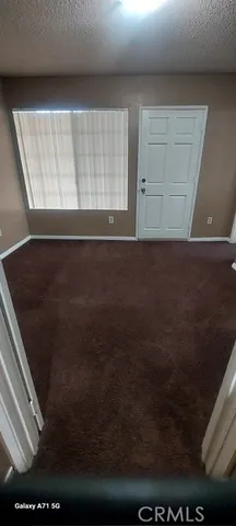 a view of wooden floor and cabinets