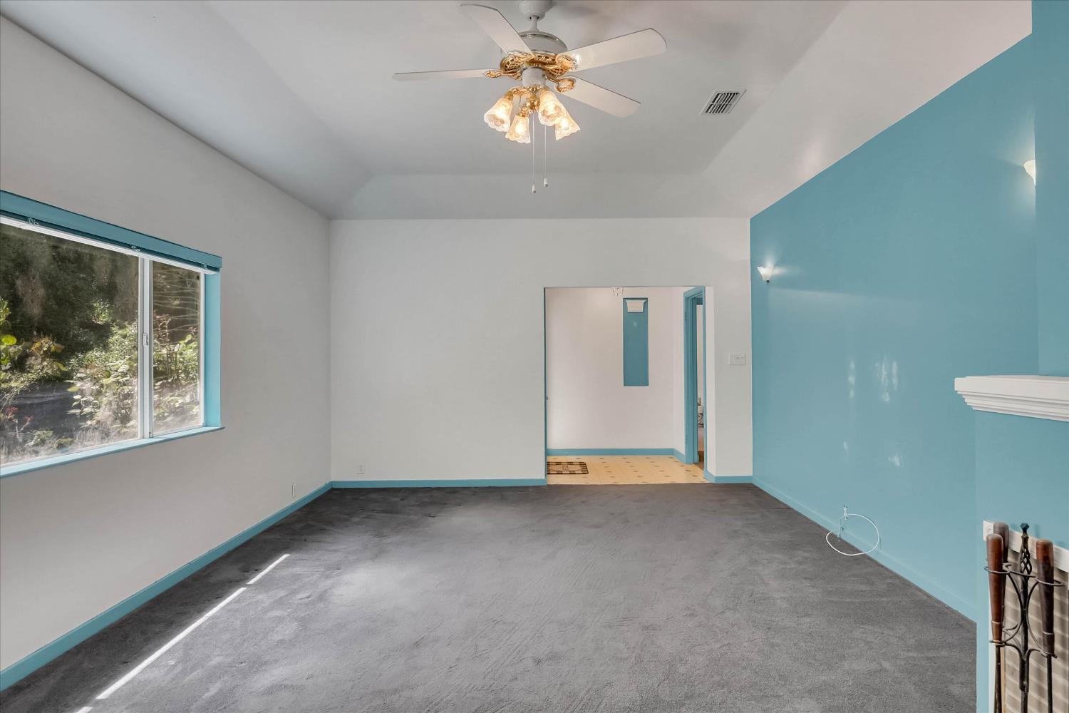 39640 South River Road Clarksburg, CA 95612 - Photo 7 of 25 a view of an empty room with window and chandelier fan