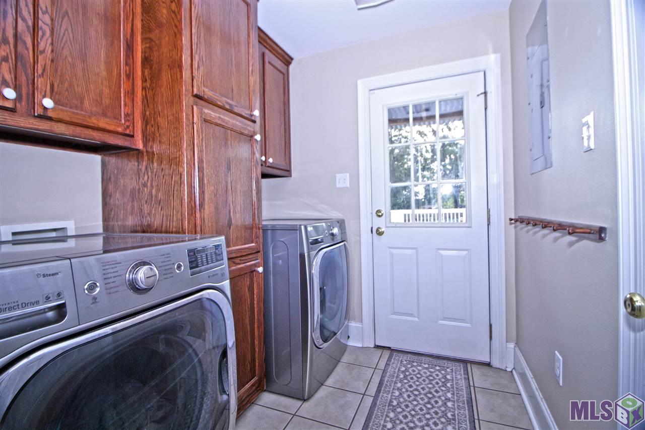7454 South River Road Addis, LA 70710 - Photo 25 of 29 Large Laundry with tons of built in storage