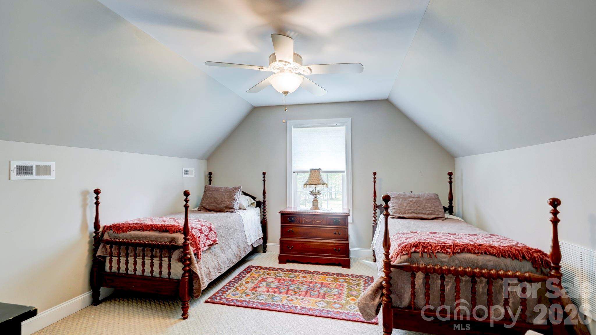 1775 Enochville Road Kannapolis, NC 28081 - Photo 39 of 41 a bedroom with a bed and a chandelier