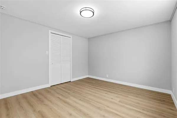 a view of room with wooden floor