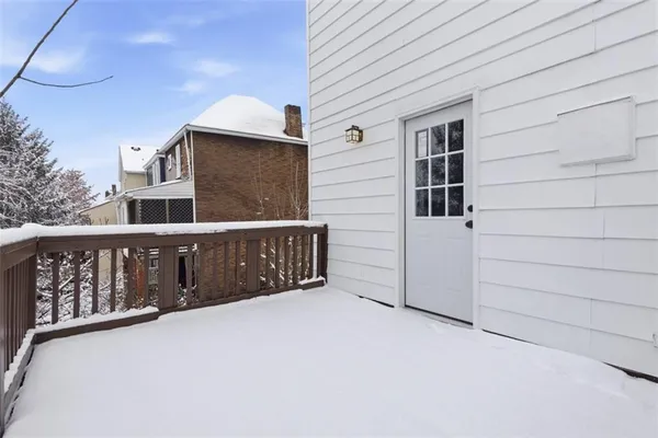 a view of a house with wooden fence