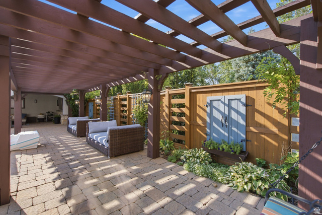 12308 Mariah Circle Draper, UT 84020 - Photo 154 of 293 Expansive outdoor patio featuring a wooden pergola, paver flooring, perimeter fencing, and established plantings