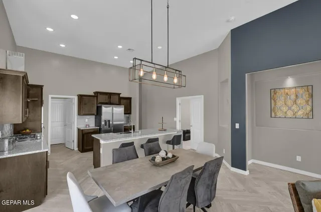 a view of a dining room with furniture wooden floor and chandelier