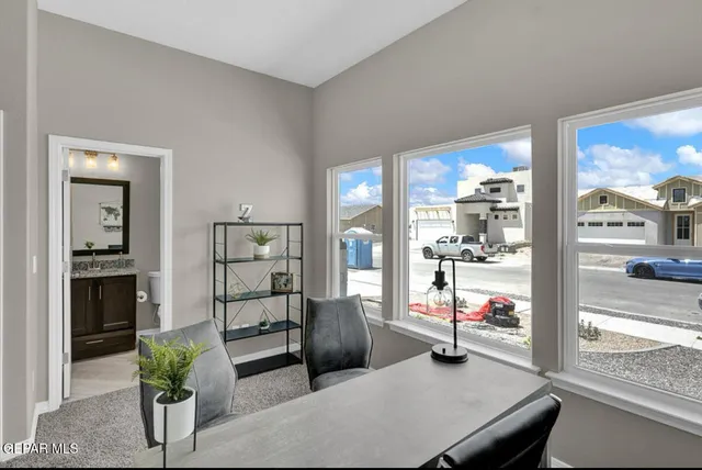 a bathroom with a granite countertop toilet a sink and a mirror