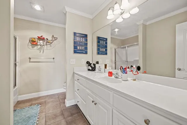 a bathroom with a sink a mirror and a shower