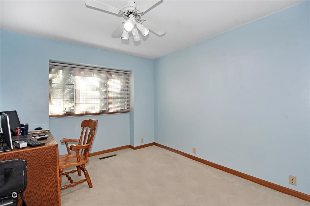 713 Southgate Road New Lenox, IL 60451 - Photo 14 of 25 a view of a workspace with furniture and a window