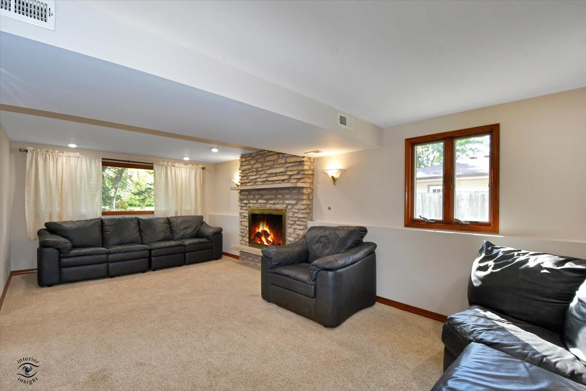 713 Southgate Road New Lenox, IL 60451 - Photo 15 of 25 a living room with furniture window and a fireplace