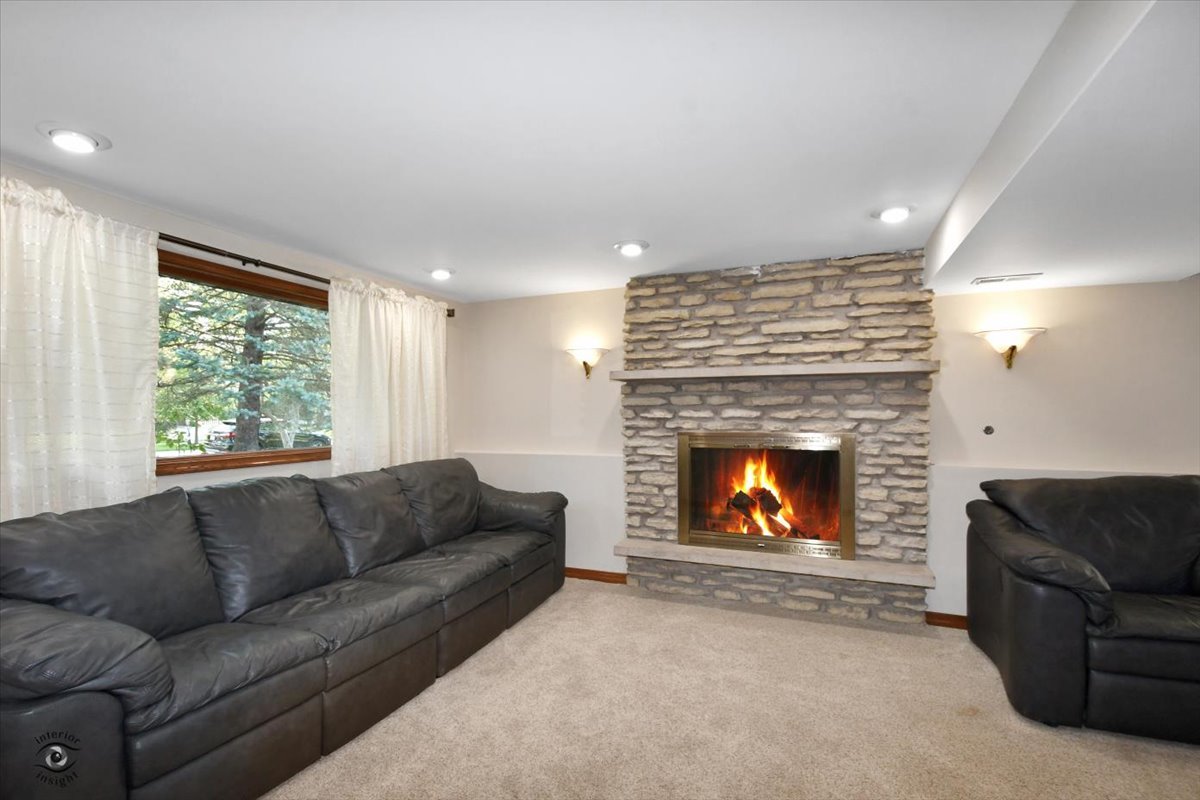 713 Southgate Road New Lenox, IL 60451 - Photo 16 of 25 a living room with furniture and a fireplace