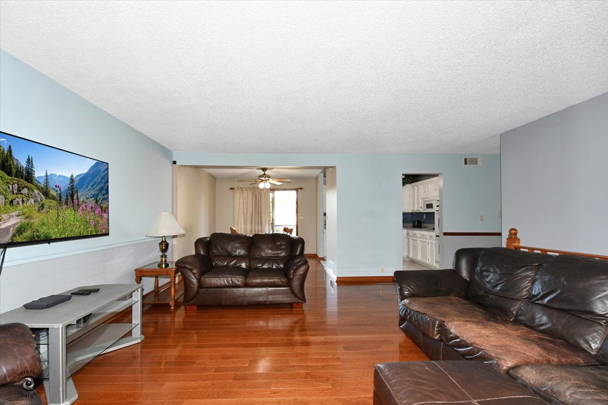 713 Southgate Road New Lenox, IL 60451 - Photo 5 of 25 a living room with furniture window and a flat screen tv