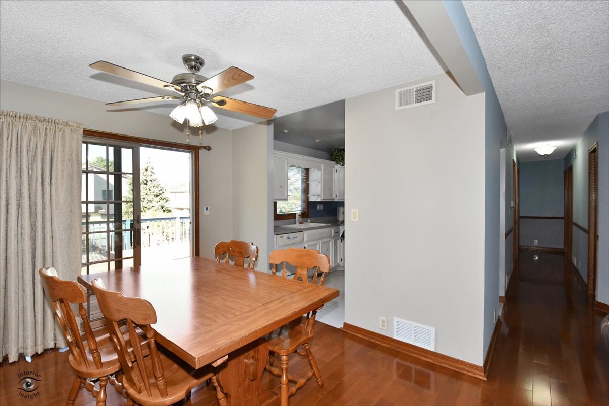 713 Southgate Road New Lenox, IL 60451 - Photo 6 of 25 a view of a dining room with furniture and wooden floor