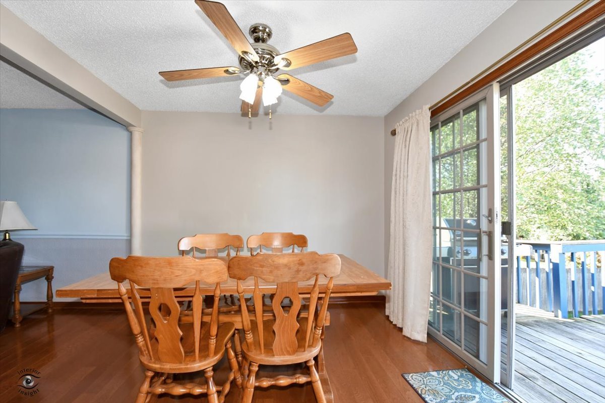 713 Southgate Road New Lenox, IL 60451 - Photo 7 of 25 a view of a dining room with furniture window and wooden floor