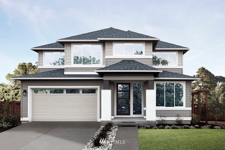 3502 Southeast 18th Street Renton, WA 98058 - Photo 1 of 3 a front view of a house with a garden