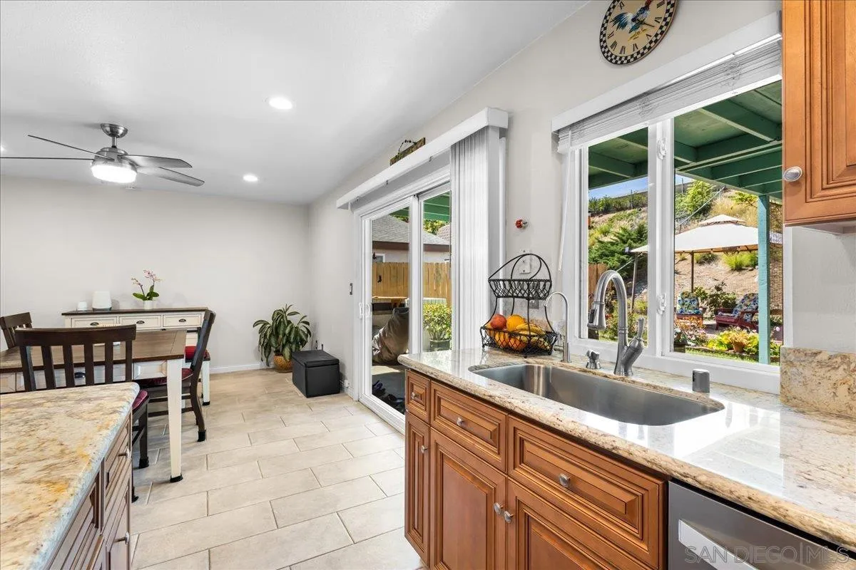 10738 2nd Street Santee, CA 92071 - Photo 9 of 52 a kitchen with a sink and a large window