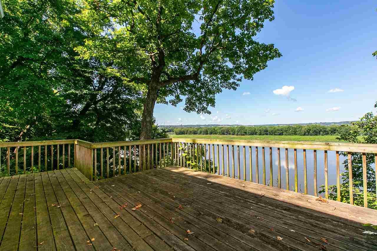 4804 South River Road Hanover, IL 61041 - Photo 25 of 31 a view of balcony with wooden floor and fence