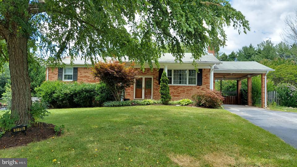 37730 Apache Road Charlotte Hall, MD 20622 - Photo 1 of 21 a front view of a house with a yard