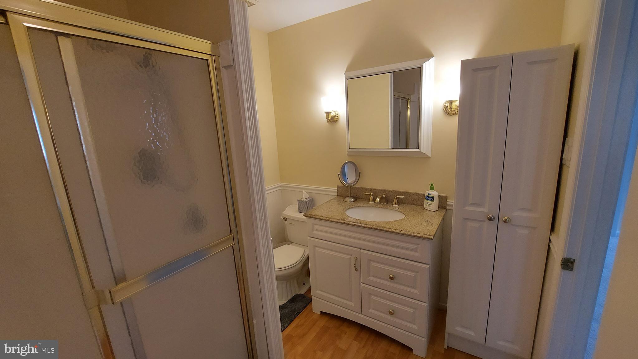37730 Apache Road Charlotte Hall, MD 20622 - Photo 11 of 21 a bathroom with a granite countertop sink toilet and shower