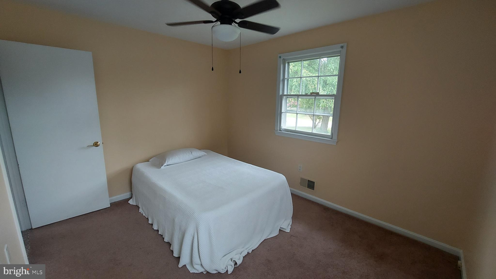 37730 Apache Road Charlotte Hall, MD 20622 - Photo 12 of 21 a bedroom with a bed and window