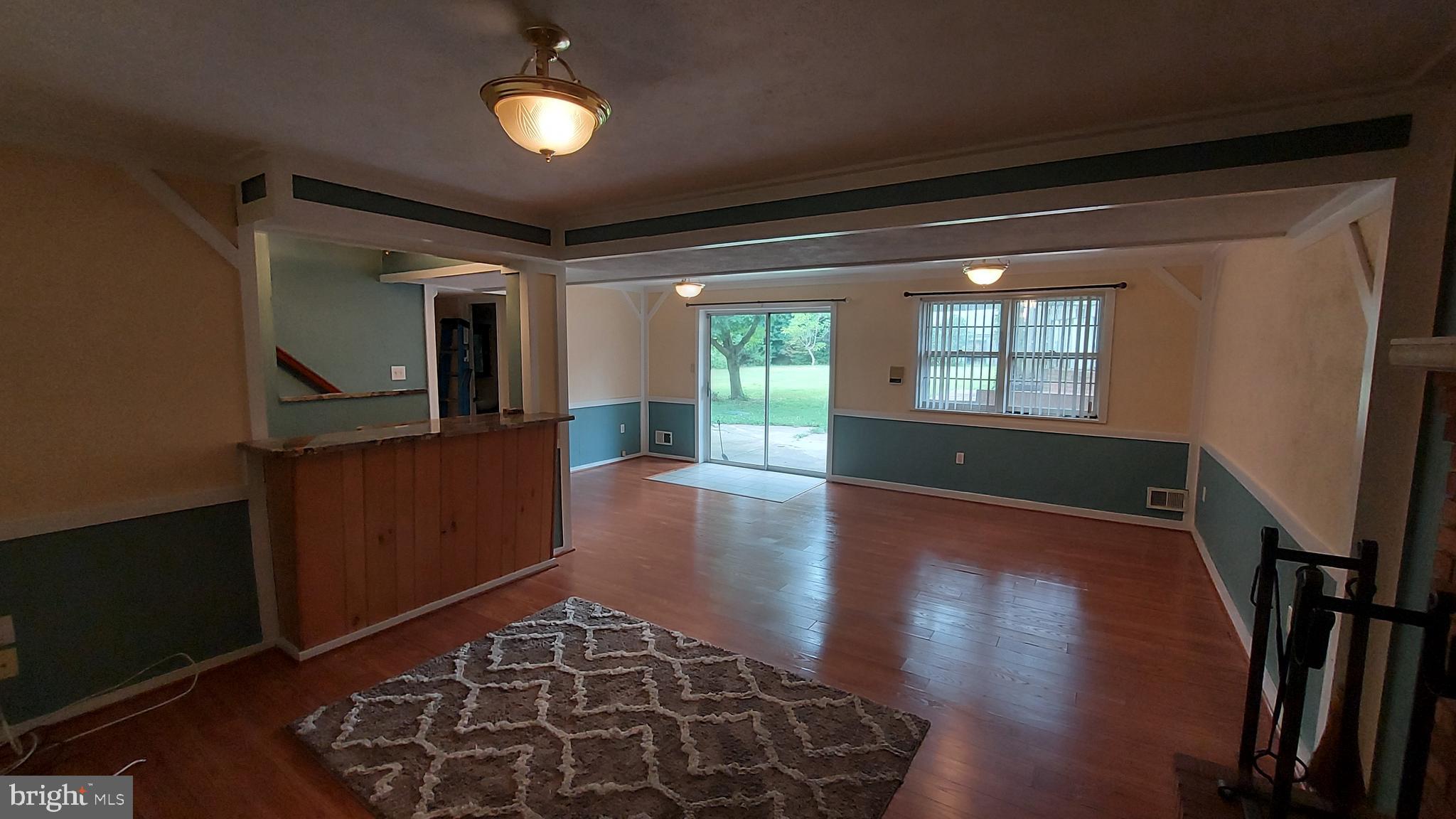 37730 Apache Road Charlotte Hall, MD 20622 - Photo 18 of 21 a view of a hallway with wooden floor and furniture