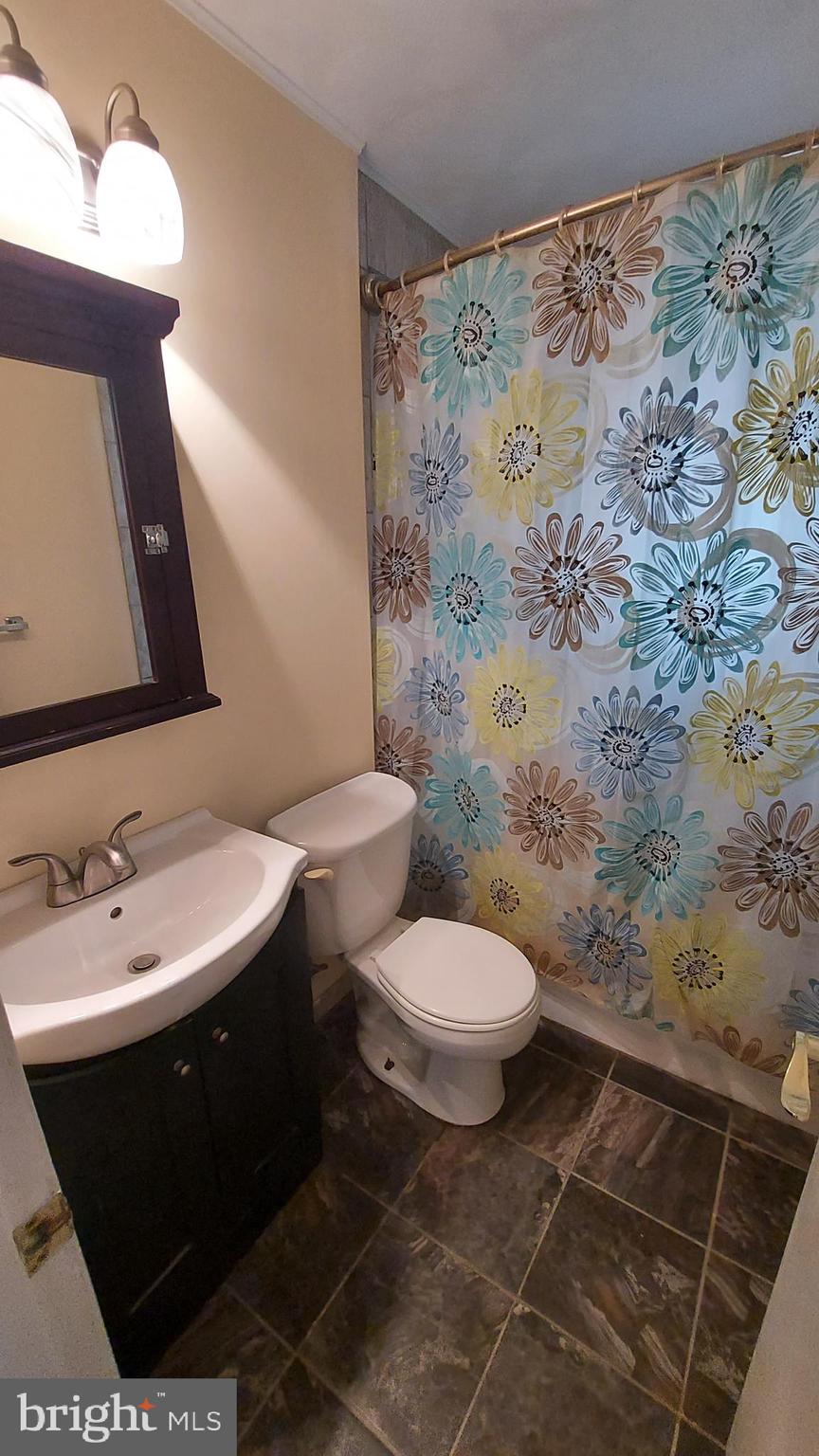 37730 Apache Road Charlotte Hall, MD 20622 - Photo 19 of 21 a bathroom with a sink toilet and shower