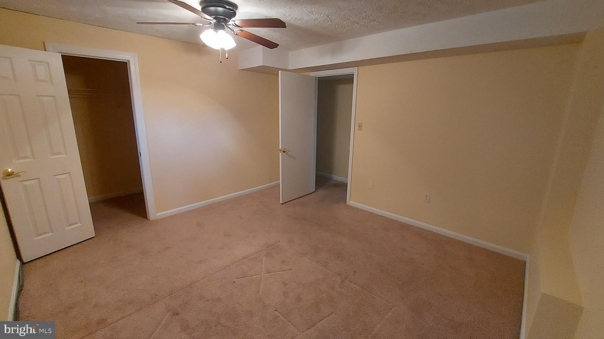 37730 Apache Road Charlotte Hall, MD 20622 - Photo 20 of 21 an empty room with a fan and a fan