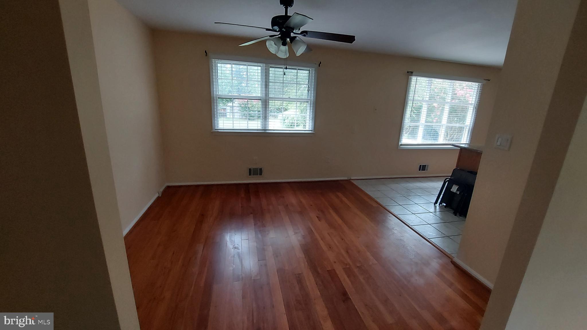37730 Apache Road Charlotte Hall, MD 20622 - Photo 9 of 21 wooden floor in an empty room with a window