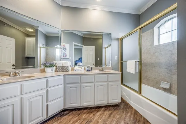 a bathroom with a double vanity sink and mirror