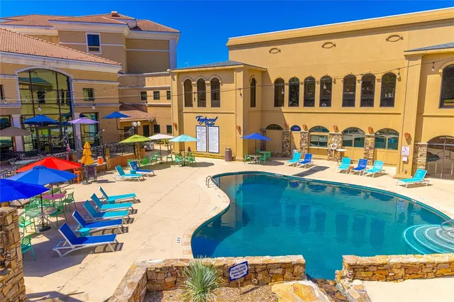 a front view of a building with outdoor seating