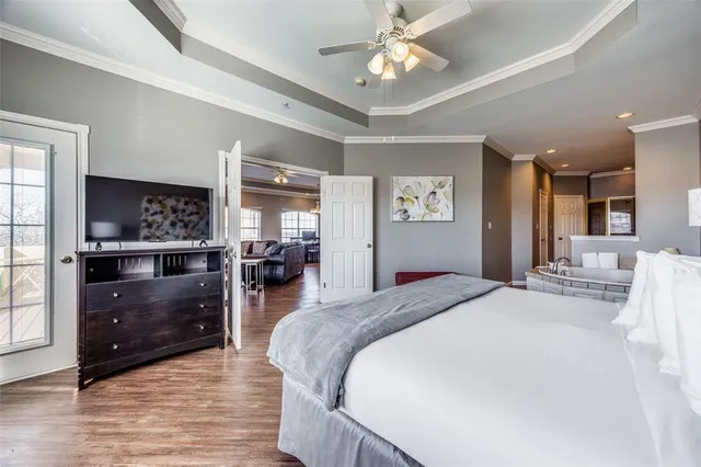 a bed room with furniture and wooden floor