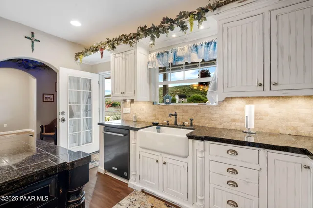 a bed room with a bed and a chandelier