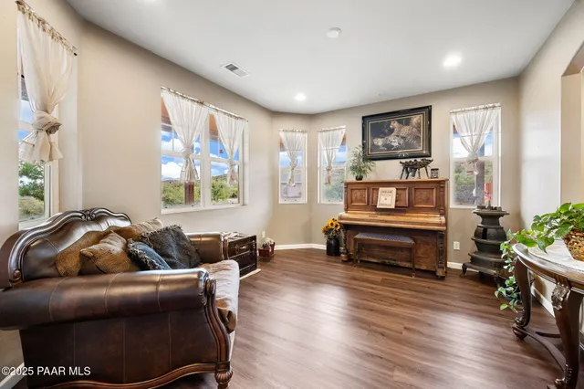 a view of staircase with lots of frames on wall
