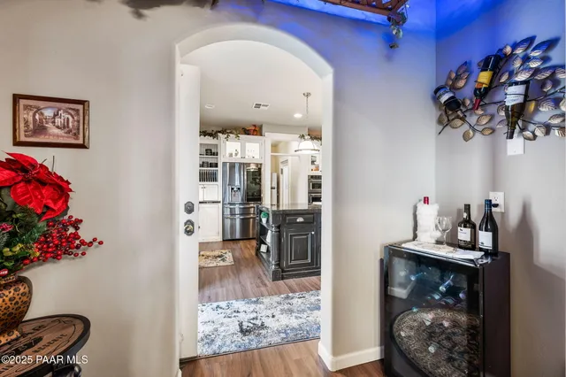 a living room with furniture and a ceiling fan