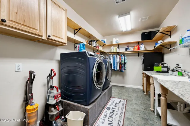 a bathroom with a granite countertop sink a toilet and a mirror
