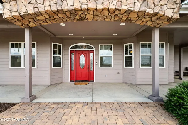a living room with furniture flat screen tv and a fireplace