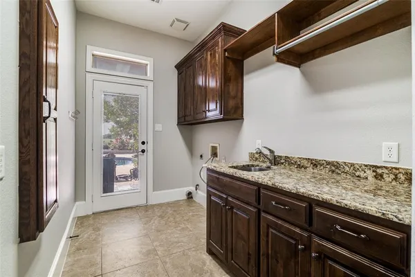 a kitchen with a sink and a refrigerator