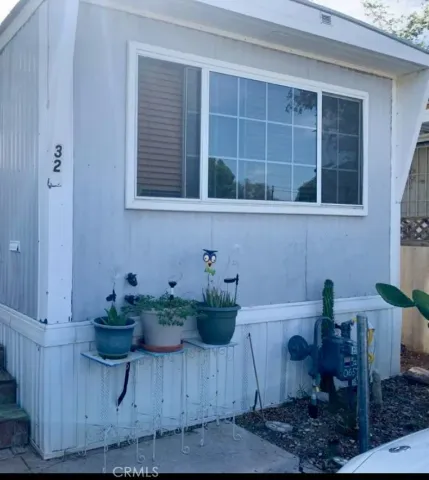a view of table chair and potted plant