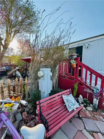 a view of a backyard with sitting area