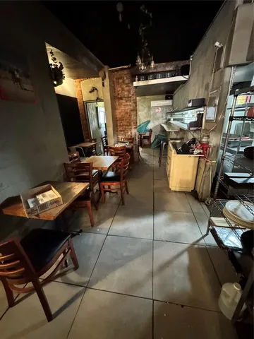 a view of a chairs and tables in a room