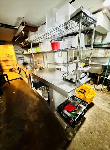 a room with gym equipment and a view of living room