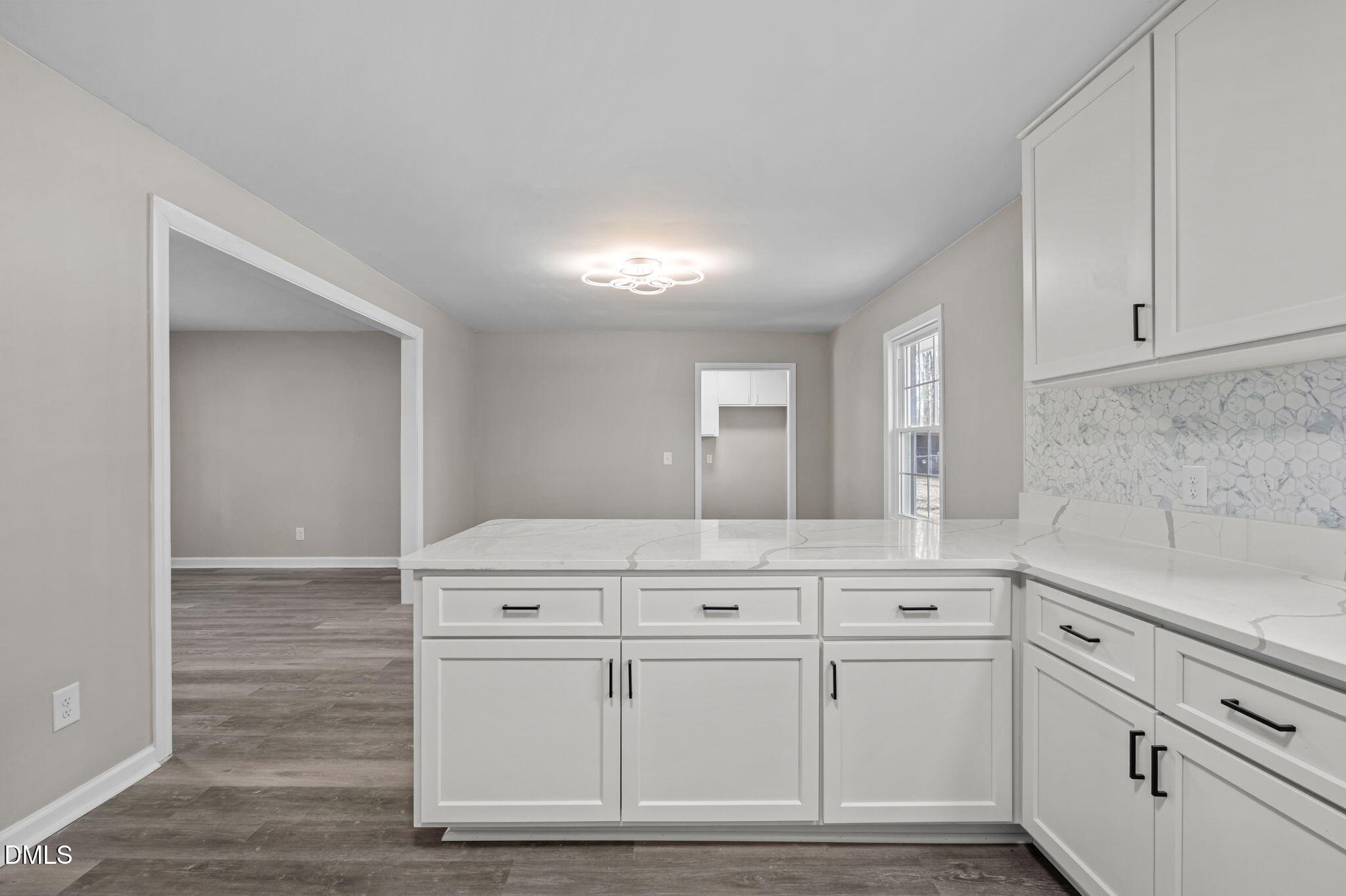 42 South 2nd Street Roxboro, NC 27573 - Photo 13 of 26 a kitchen with granite countertop white cabinets and white appliances