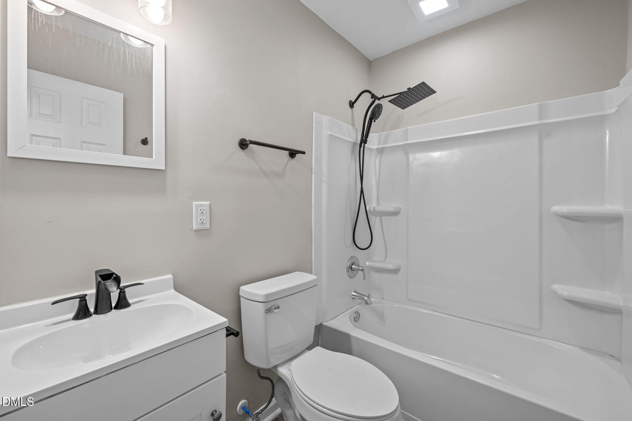 42 South 2nd Street Roxboro, NC 27573 - Photo 17 of 26 a bathroom with a toilet sink vanity and shower