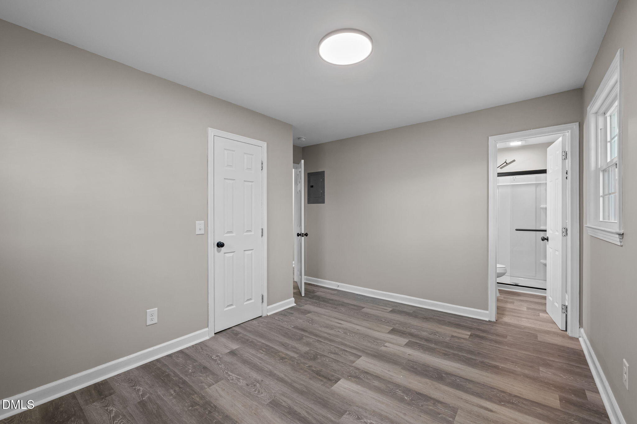 42 South 2nd Street Roxboro, NC 27573 - Photo 18 of 26 a view of an empty room and wooden floor
