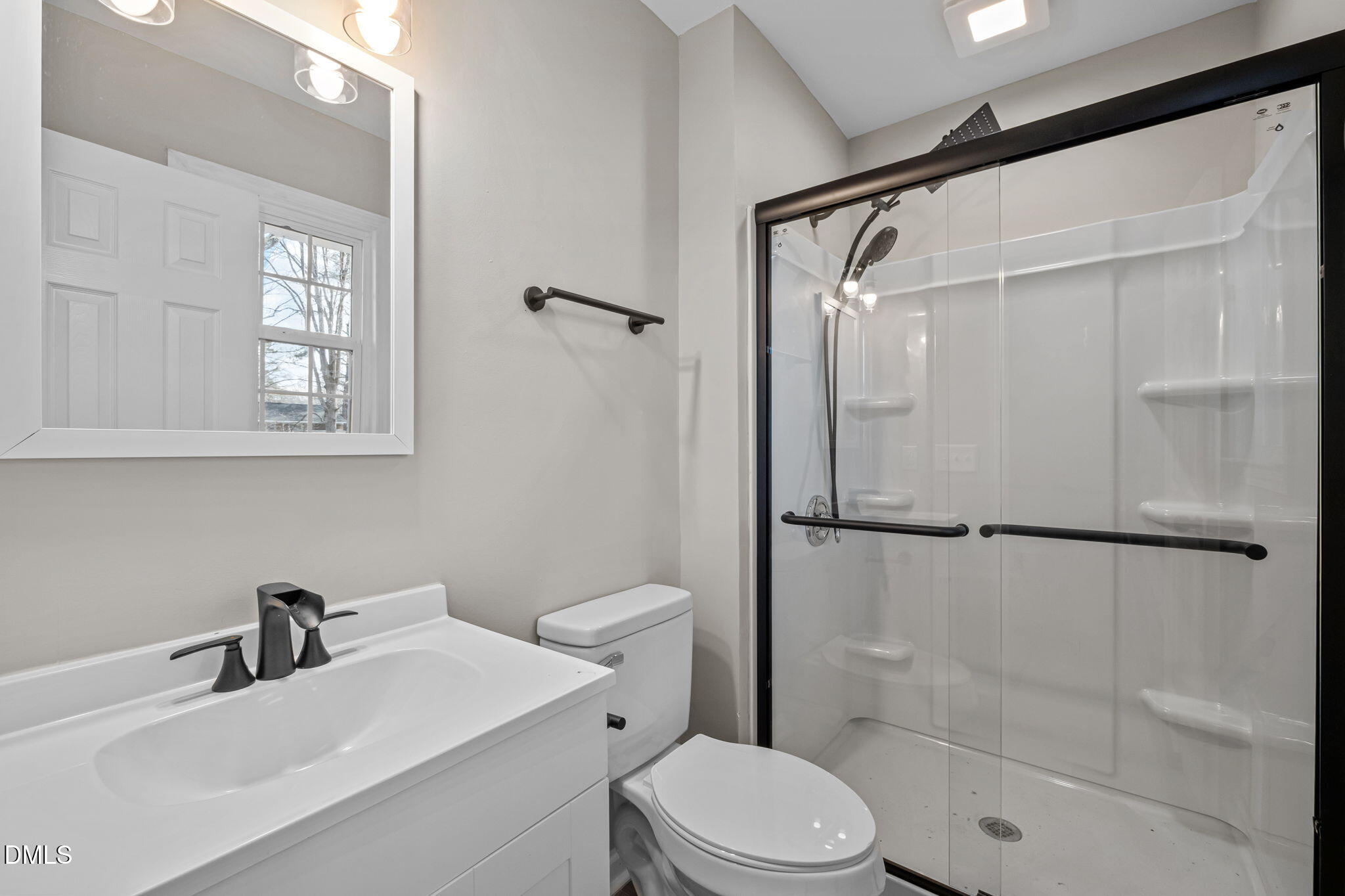 42 South 2nd Street Roxboro, NC 27573 - Photo 19 of 26 a white toilet sitting next to a bathroom sink