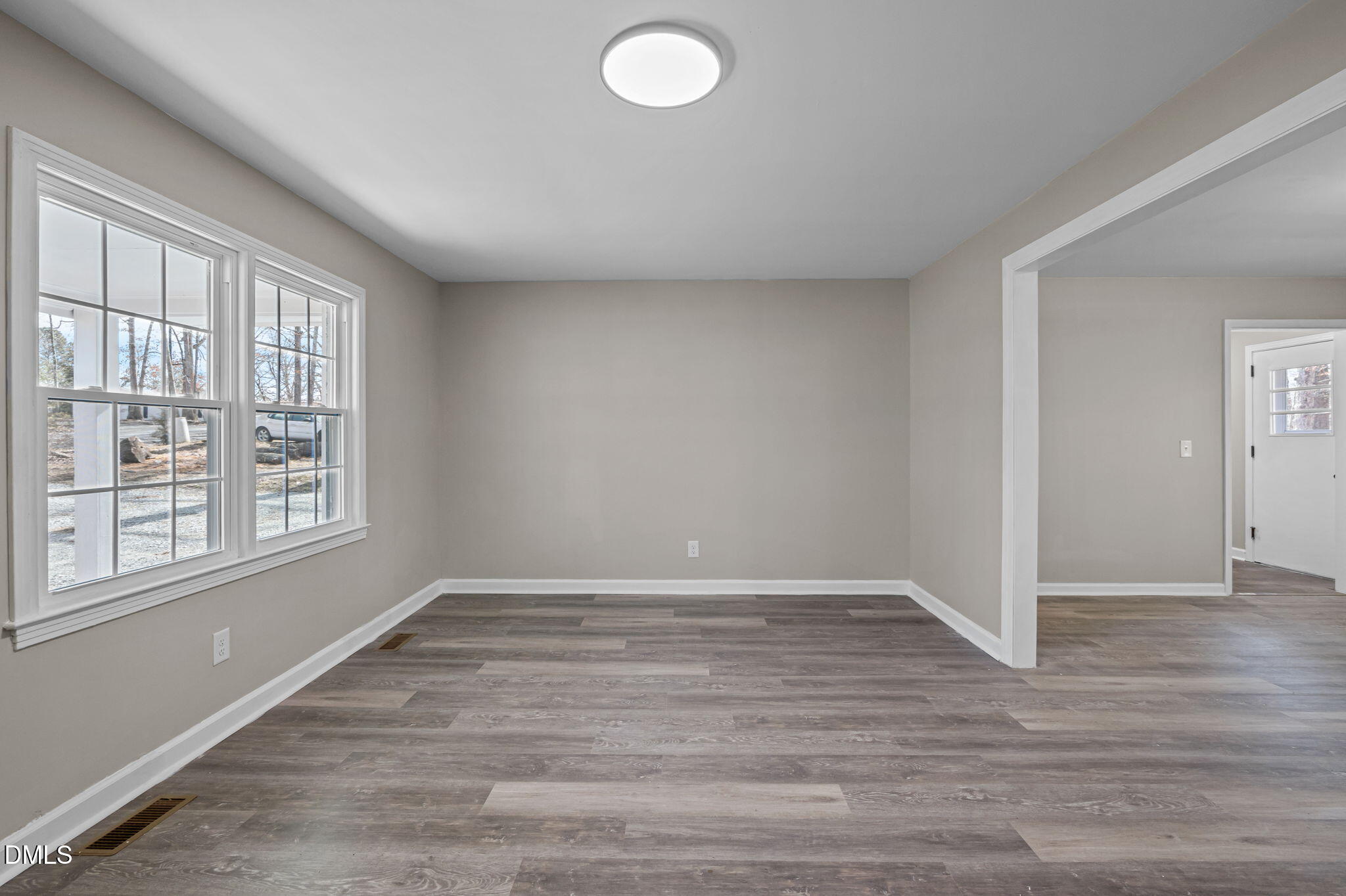 42 South 2nd Street Roxboro, NC 27573 - Photo 4 of 26 wooden floor in an empty room with a window