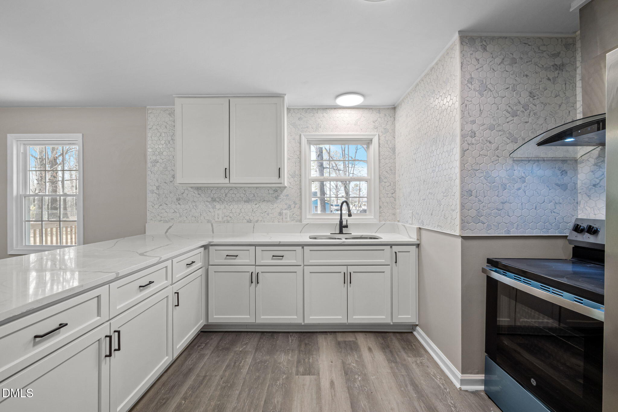 42 South 2nd Street Roxboro, NC 27573 - Photo 10 of 26 a kitchen with sink cabinets and window