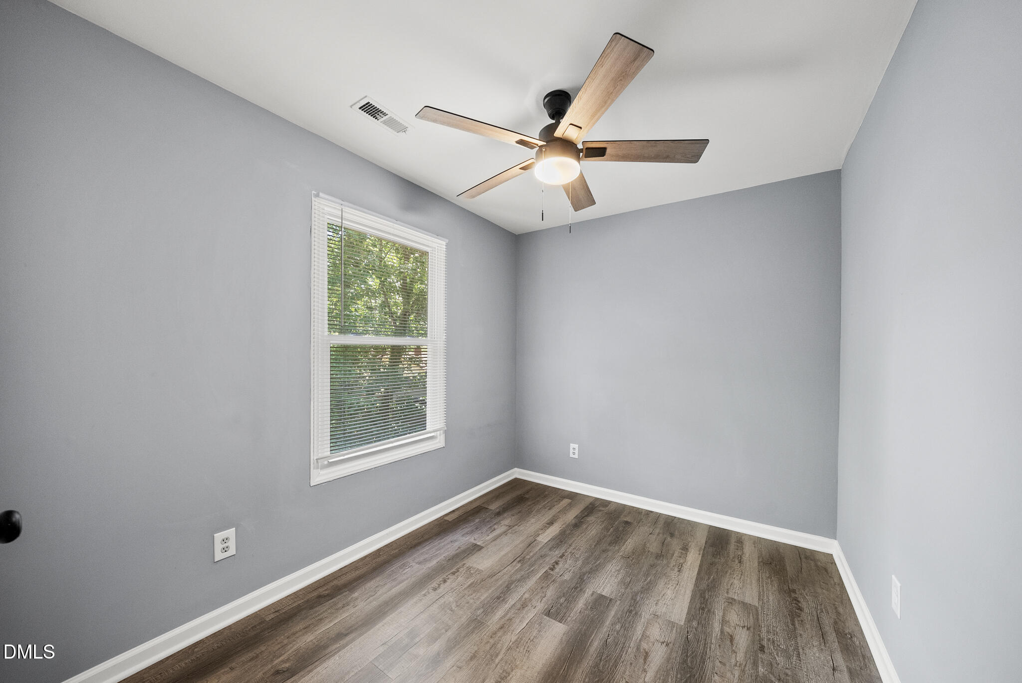 2108 Treverton Place Raleigh, NC 27609 - Photo 16 of 30 an empty room with windows and fan