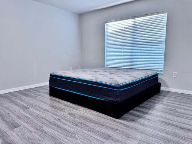 a sitting area with wooden floor